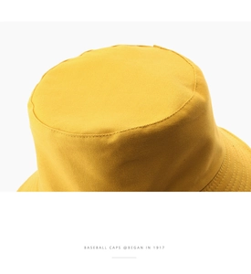 Close-up of ginger cotton bucket hat showing detailed stitching and twill fabric texture