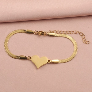 Detail view of a gold heart pendant on a flat snake chain with lobster clasp closure