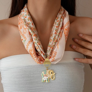 Floral print silk scarf necklace featuring a vintage gold elephant pendant with pearls