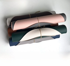 Macro detail of soft rollable PU leather placemats in multiple colors with rope ties