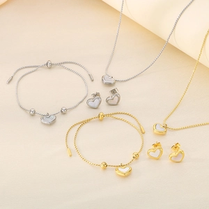 Detail of gold and silver shell heart jewelry sets with necklaces bracelets and earrings