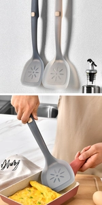 Detailed view of gray non-stick silicone spatulas with flower holes used for cooking eggs