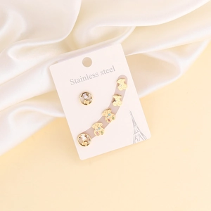 Detail view of five gold stainless steel bear earrings with colorful zircon inlay