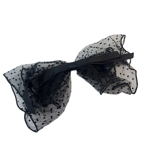 Elegant black polka dot mesh bow hair clip with French vintage ribbon in a 3D aesthetic