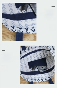 Detailed view of reinforced blue canvas piping and internal storage pocket on a tote bag