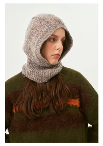 Close-up of greyish pink knitted balaclava showing soft texture and cozy knit pattern