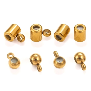 Detailed macro of gold plated stainless steel spacer beads with silicone inserts