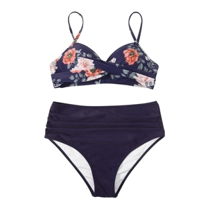 Detail of high-waisted bikini set with purple floral print and front twist knot