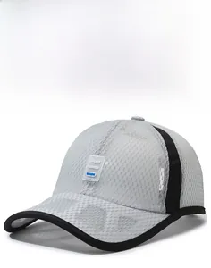 Detail of grey mesh baseball cap featuring honeycomb breathable fabric and sport logo