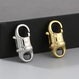 Close-up of gold and silver lobster clasps showing polished metal texture for DIY jewelry