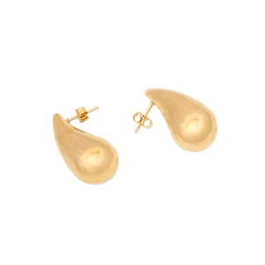 Macro detail of polished gold teardrop stud earrings with secure butterfly backings