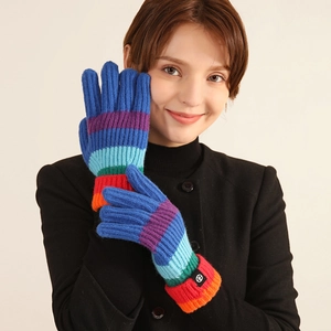 Rainbow striped knit full-finger gloves for winter with warm ribbed cuffs on model