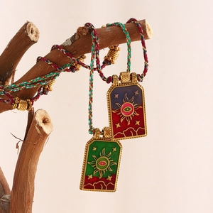 Tarot sun pendant necklaces in 18K gold plated steel on colorful braided ropes