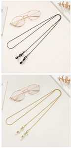 Detail of gold and gunmetal snake chain glasses holders with anti-slip silicone loops
