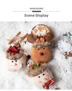 Detailed view of Christmas plush gift bags with Santa, reindeer, and snowman designs