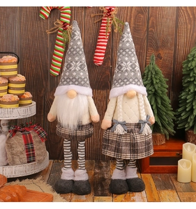 Close-up of telescopic Christmas gnome dolls with Nordic snowflake hats and knit outfits