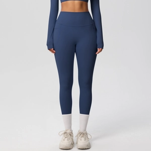 Detail of high waisted yoga pants with side pockets and brushed matte fabric texture