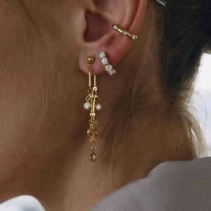 18K gold plated stainless steel tassel earrings with white zircon on female model