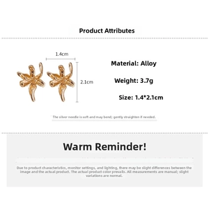 Detailed view of golden flower earrings with dimensions of 1.4cm by 2.1cm and silver needles