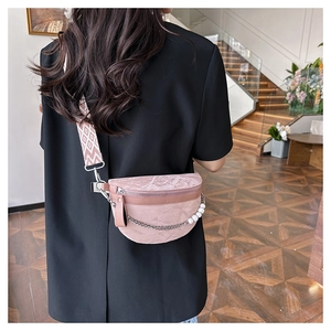 Detailed back view of a pink marble texture chest bag with pearl chain and woven strap