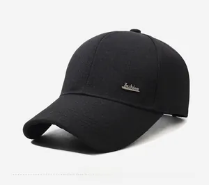 Close-up of black cotton twill cap with silver Fashion metal logo and side profile