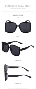 Three-angle views of large frame black sunglasses with grey lenses and metal accents
