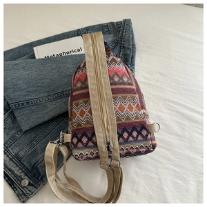 Close-up of bohemian geometric woven fabric on a lightweight ethnic style backpack
