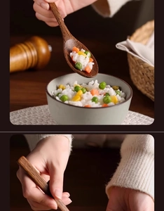 Close-up of a long-handle wooden spoon scooping rice with peas and carrots