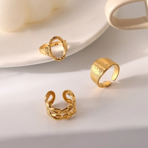 Three-piece gold stainless steel adjustable rings set featuring hollow chain and hammered texture
