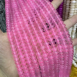 Detail of pink translucent abacus beads string with natural gemstone texture