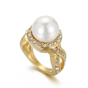Exaggerated gold titanium ring with a large white pearl and pave-set zircons