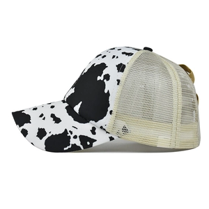 Criss-cross ponytail baseball cap with cow print and breathable mesh back for women