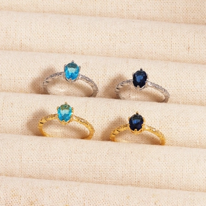 Elegant gold and silver rings with blue zircon oval stones in minimalist ins style
