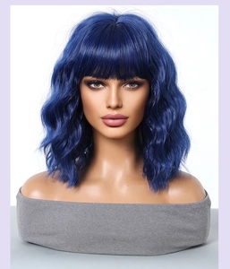 Detail of dark blue shoulder-length wavy bob wig with bangs and natural hair texture