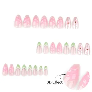 French green gradient press-on nails with 3D floral accents and golden bead charms