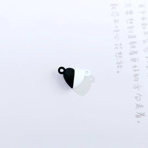 Detail of heart-shaped magnetic clasp in black and white for DIY bracelet making