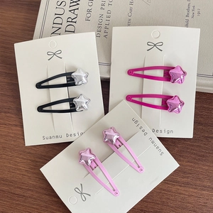 Metallic star-shaped hair clips for girls in black, hot pink, and light pink colors
