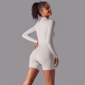 Detailed back view of a slim-fit long-sleeve athletic bodysuit in beige grey
