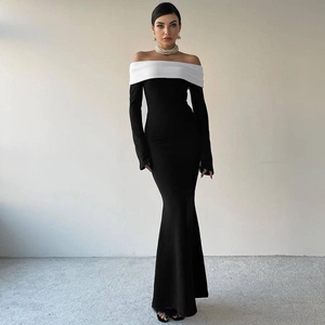 Detail view of the elegant off-shoulder long sleeve design and fishtail hem on this dress