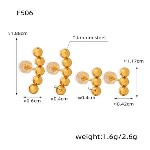 Macro shot of gold-plated titanium steel bead earrings with precise dimension measurements