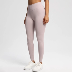 Detail view of high-waist light purple seamless yoga pants showing peach hip lifting effect