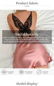 Detail of pink imitation silk nightdress featuring a black lace butterfly back design