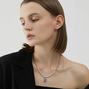 Asymmetric S925 silver necklace with pearls and purple crystal pendant on model