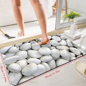 Detail showing 3D pebble pattern non-slip bath mat with dimensions 80x50cm and fast drying texture