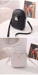 Close-up of diamond quilted crossbody phone bags with cute rabbit metal buckles