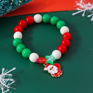 Christmas beaded bracelet with Santa Claus pendant and festive green and red beads