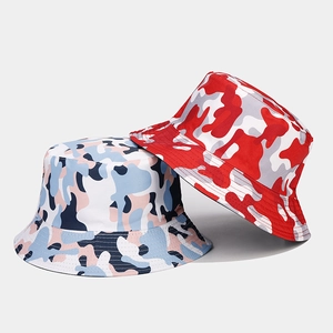 Flat lay of camo bucket hats showing red, white, and blue camouflage print patterns