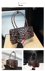 Detailed view of leopard print shoulder bag with heart-shaped rivet charm accessory
