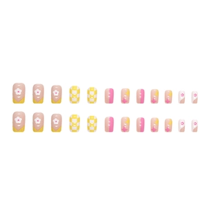 Colorful square press-on nails featuring yellow plaid and white daisy flower patterns