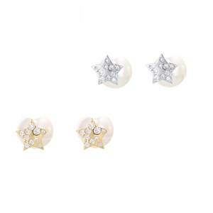 Detailed view of star-shaped zircon stud earrings with large white pearls in gold and silver